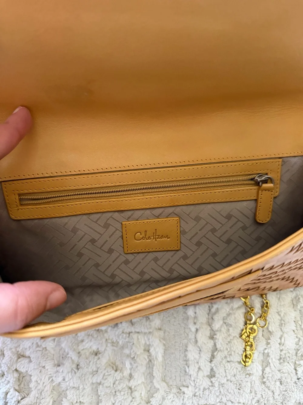 Cole Haan's iconic Genevieve woven leather tan crossbody bag